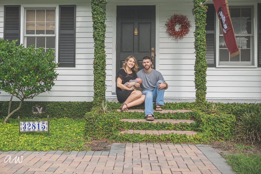 new family on their front porch with ivy and florida state flag