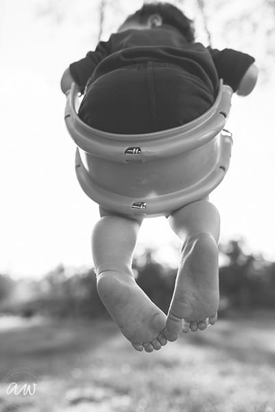 tampa family photographer alison winterroth photography little boys feet on swing