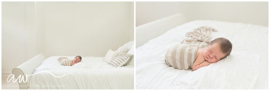 Newborn baby on a bed with a tan striped wrap in Alison Winterroth's south tampa studio.