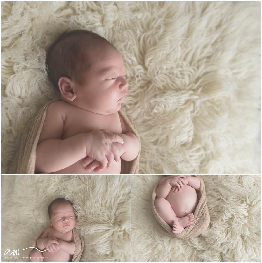 Baby laying on a cream wool rug.