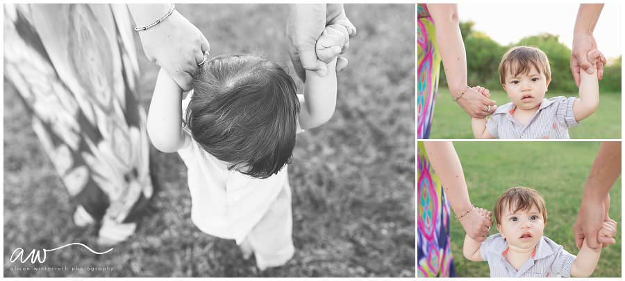 Little baby holding his parent's hands at picnic island in the Tampa Area.