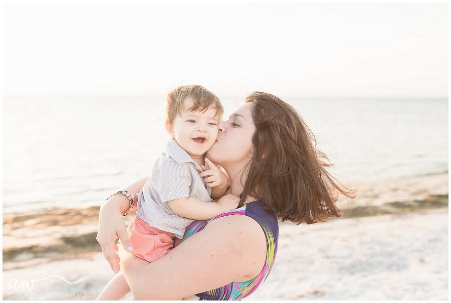 Mom kissing baby photographed by Alison Winterroth.