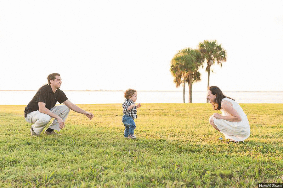 A toddler takes his first steps in Tampa Fl www.alisonwinterroth.com
