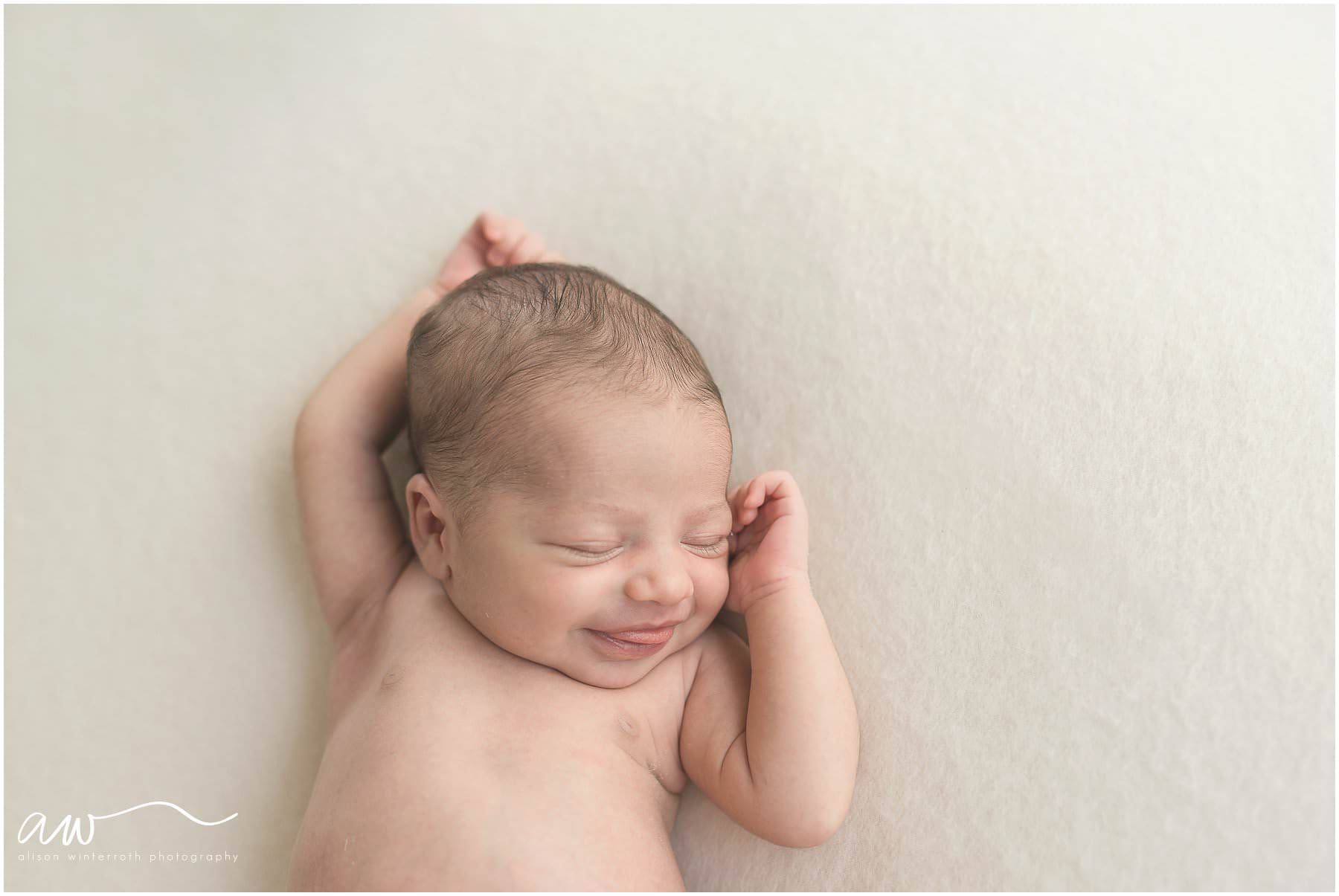 A sweet baby girl smiles at her photography session {South Tampa Newborn Photographer Alison Winterroth}