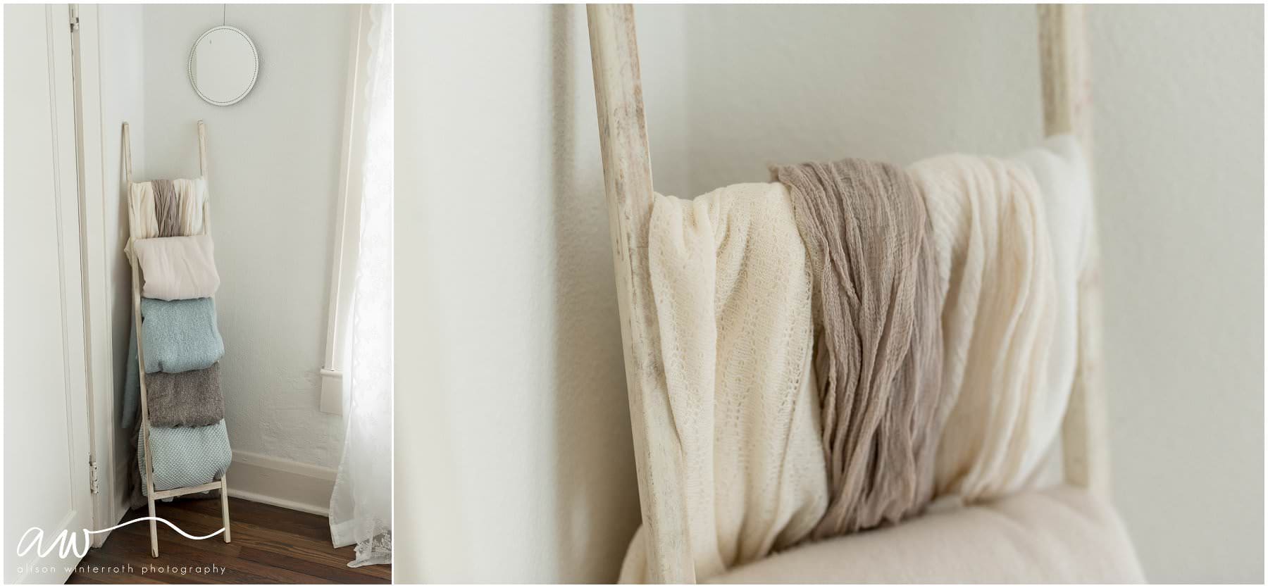 A wooden ladder with baby wraps