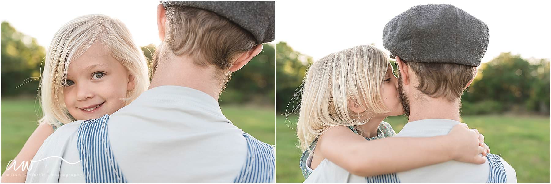 A blonde girl kisses her father on his cheek outdoors