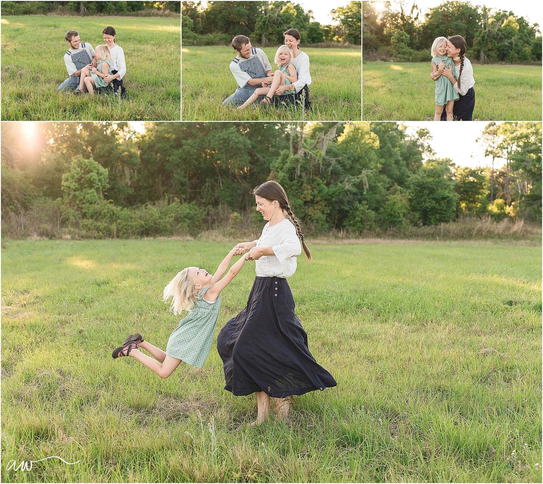 A mother spins her daughter in an outdoor area