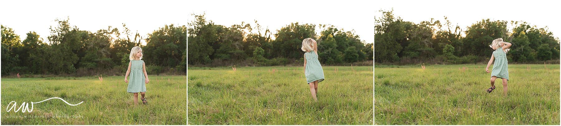 A young girl twirling in an open field