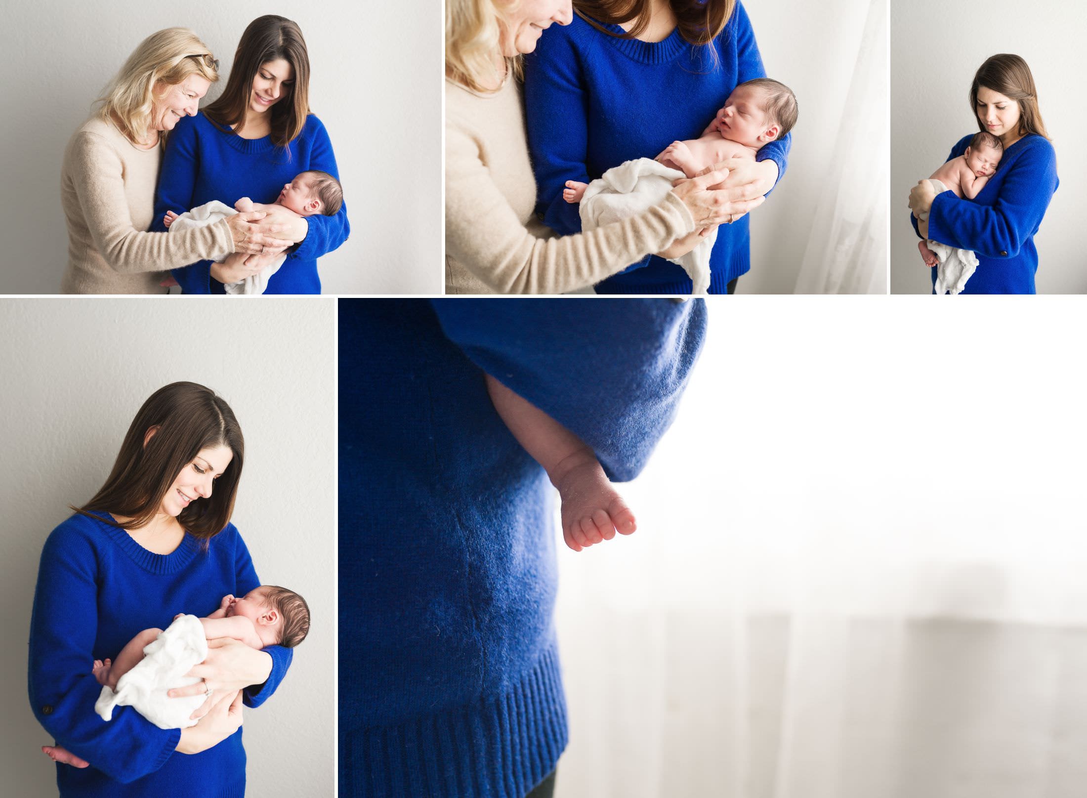 a mom and her mother hold a brand new baby boy in a natural light photography studio