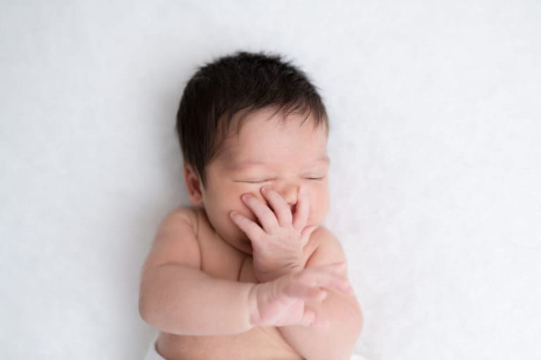A baby making a silly face.
