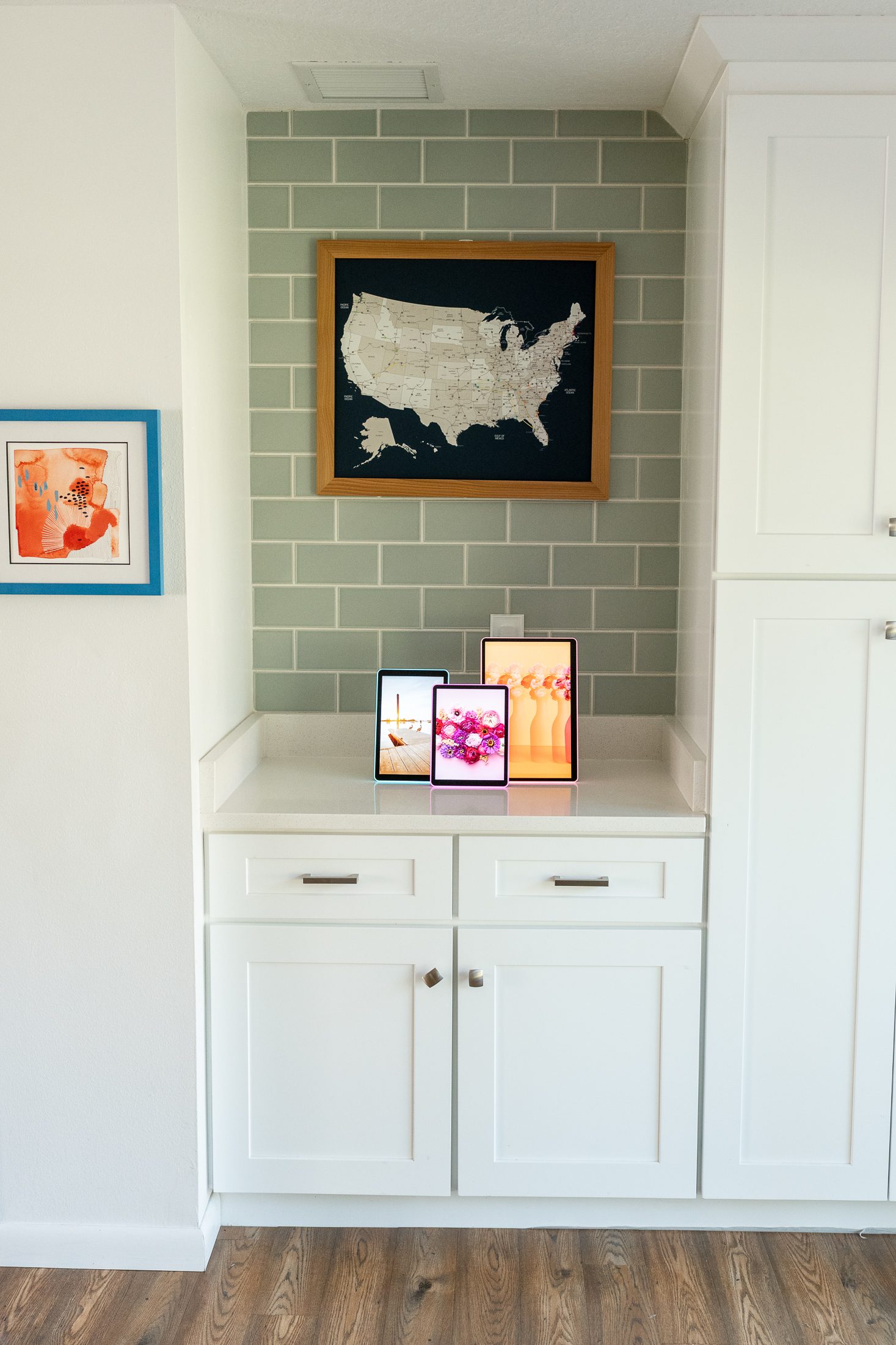 lifestyle image of the neon apolosign photo frame in a kitchen area with white cabinets