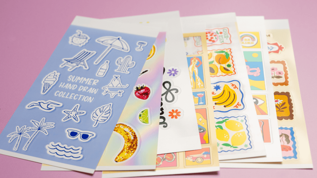 a stack of sticker sheets printed with the liene pixcut s1 printer